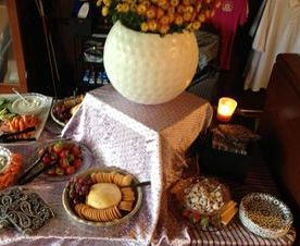 Catering for an event spread out on a table includes various finger foods 