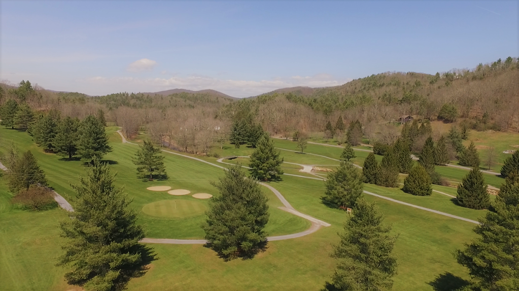 Arial view of course, viewing cart and trees 